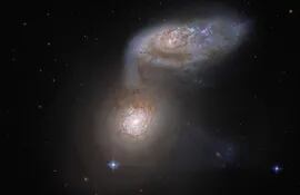 Dos galaxias tan entrelazadas que incluso reciben un nombre colectivo: Arp 91.