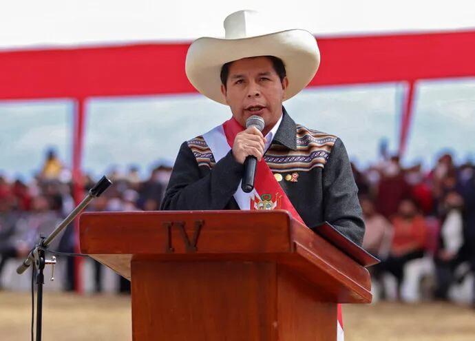 This handout picture released by the Peruvian presidency shows Peruvian President Pedro Castillo delivering a speech during his symbolic presidential investiture ceremony at Pampa de la Quinua in Ayacucho, southern Peru, on July 29, 2021. - Peru's new president, leftist Pedro Castillo, appointed Guido Bellido as the new Prime Minister in a symbolic ceremony with foreign dignitaries at the Pampa de la Quinua, site of the Battle of Ayacucho on December 9, 1824, which sealed the independence of Peru and the rest of Hispanic America. (Photo by Alberto ORBEGOSO / Peruvian Presidency / AFP) / RESTRICTED TO EDITORIAL USE - MANDATORY CREDIT "AFP PHOTO / PERUVIAN PRESIDENCY / Alberto ORBEGOSO"  - NO MARKETING NO ADVERTISING CAMPAIGNS -DISTRIBUTED AS A SERVICE TO CLIENTS