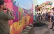 Una treintena de murales visitaron esta mañana los participantes de la actividad "Colores de la Chacarita", con la cual se reactivaron las visitas turísticas al barrio Ricardo Brugada.
