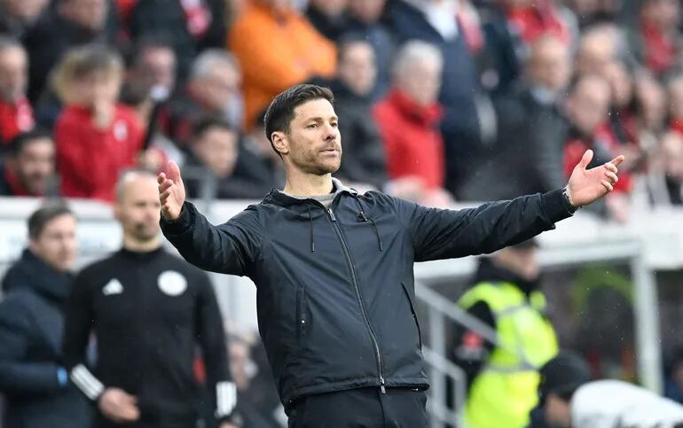 (FILES) Bayer Leverkusen's Spanish head coach Xabi Alonso reacts after the end of the German first division Bundesliga football match SC Freiburg v Bayer 04 Leverkusen in Freiburg, southwestern Germany on March 17, 2024. Xabi Alonso, who was seen by many as Liverpool's top target to replace Jurgen Klopp as their manager, said on March 29, 2024 he is staying at Bundesliga leaders Bayer Leverkusen next season. (Photo by THOMAS KIENZLE / AFP) / DFL REGULATIONS PROHIBIT ANY USE OF PHOTOGRAPHS AS IMAGE SEQUENCES AND/OR QUASI-VIDEO