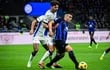 Atalanta's Albanian defender #19 Berat Djimsiti (C) fights for the ball with Inter Milan's Argentine forward #10 Lautaro Martinez (R) during the Italian Serie A football match between Inter Milan and Atalanta in Milan, on February 28, 2024. (Photo by Piero CRUCIATTI / AFP)