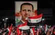 Ciudadanos sirios festejan la cuarta reelección del presidente Bashar al Asad, en mayo de 2021.