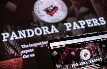 This photograph illustration shows the logo of Pandora Papers, in Lavau-sur-Loire, western France, on October 4, 2021. - Russia on October 4 dismissed revelations leaked in the Pandora Papers as "unsubstantiated claims" after an investigation by a media consortium shone a light on wealth amassed by Kremlin-linked individuals. 
The "Pandora Papers" investigation involving some 600 journalists from media including The Washington Post, the BBC and The Guardian is based on a leak of some 11.9 million documents from 14 financial services companies around the world. (Photo by LOIC VENANCE / AFP)