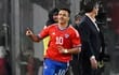 Chile's forward Alexis Sanchez celebrates an own goal scored by Paraguay's goalkeeper Antony Silva during the friendly football match between Chile and Paraguay, at the Monumental David Arellano stadium in Santiago on March 27, 2023. (Photo by MARTIN BERNETTI / AFP)