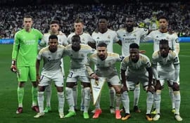 Real Madrid's players pose for a team picture before the start of the UEFA Champions League quarter final first leg football match between Real Madrid CF and Manchester City at the Santiago Bernabeu stadium in Madrid on April 9, 2024. (Photo by PIERRE-PHILIPPE MARCOU / AFP)