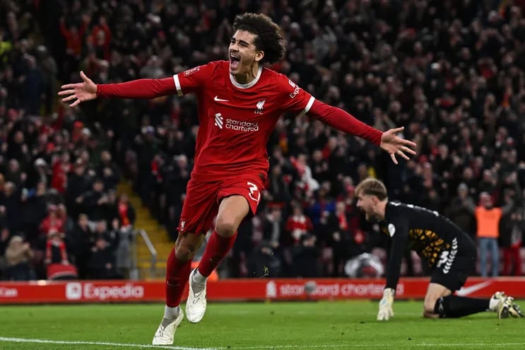 Liverpool's English striker #76 Jayden Danns celebrates after scoring their third goal during the English FA Cup fifth round football match between Liverpool and Southampton at Anfield stadium, in Liverpool, north west England, on February 28, 2024. (Photo by Paul ELLIS / AFP) / RESTRICTED TO EDITORIAL USE. No use with unauthorized audio, video, data, fixture lists, club/league logos or 'live' services. Online in-match use limited to 120 images. An additional 40 images may be used in extra time. No video emulation. Social media in-match use limited to 120 images. An additional 40 images may be used in extra time. No use in betting publications, games or single club/league/player publications. / 