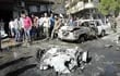 un-grupo-de-personas-observan-los-danos-causados-por-la-explosion-en-homs-siria-ayer-segun-sana-agencia-rabe-siria-de-noticias-4-personas-han-m-232358000000-573897.jpg