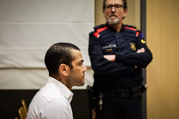 (FILES) Brazilian footballer Dani Alves looks on at the start of his trial at the High Court of Justice of Catalonia in Barcelona, on February 5, 2024. Ex-Brazil star Dani Alves has been sentenced to 4.5 years in jail for rape, Barcelona's court announced on February 22, 2024. (Photo by Jordi BORRAS / POOL / AFP)