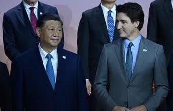 El presidente chino Xi Jingping y el primer ministro canadiense Justin Trudeau.