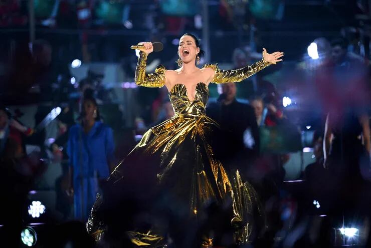 US artist Katy Perry performs inside Windsor Castle grounds at the Coronation Concert, in Windsor, west of London on May 7, 2023. - For the first time ever, the East Terrace of Windsor Castle will host a spectacular live concert that will also be seen in over 100 countries around the world. The event will be attended by 20,000 members of the public from across the UK. (Photo by Leon Neal / POOL / AFP)
