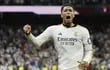 TOPSHOT - Real Madrid's English midfielder #5 Jude Bellingham celebrates scoring his team's third goal during the Spanish league football match between Real Madrid CF and FC Barcelona at the Santiago Bernabeu stadium in Madrid on April 21, 2024. (Photo by OSCAR DEL POZO / AFP)