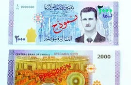 billetes-de-2-000-libras-unos-4-dolares-llevan-el-retrato-del-dictador-sirio-bachar-al-assad-efe-220858000000-1602472.jpg