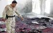 un-soldado-iraqui-observa-el-lugar-en-el-que-se-ha-producido-una-explosion-en-una-mezquita-suni-cerca-de-la-ciudad-de-baquba-65-kilometros-al-norest-223637000000-579406.jpg