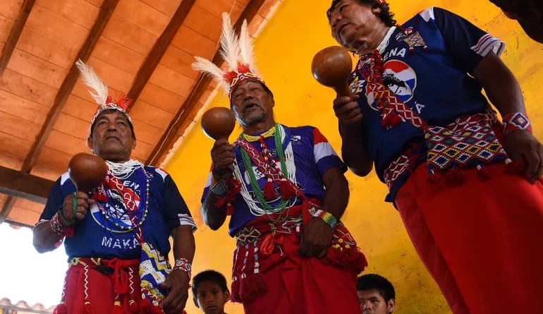 Maka indigenous are seen during the celebration in conmemoration of Russian General Juan Belaieff, a defender of the Maka tribe and their territory, in Mariano Roque Alonso, Paraguay, in January 19, 2021. (Photo by NORBERTO DUARTE / AFP)