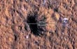 El cráter generado por el impacto de un meteorito sobre el planeta Marte.  (NASA/AFP)