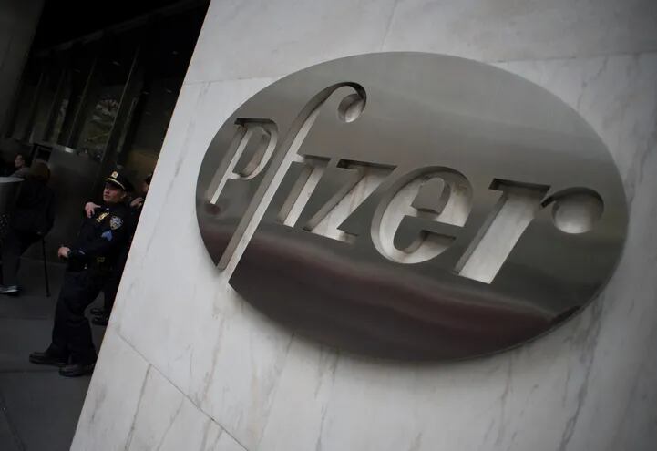 (FILES) This file photo taken on April 27, 2016 shows the Pfizer company logo on the wall in front of Pfizer�s headquarters in New York. - North Korean hackers tried to break into the computer systems of pharmaceutical giant Pfizer in a search for information on a coronavirus vaccine and treatment technology, South Korea's spy agency said on February 16, 2021, according to reports. (Photo by Don EMMERT / AFP)