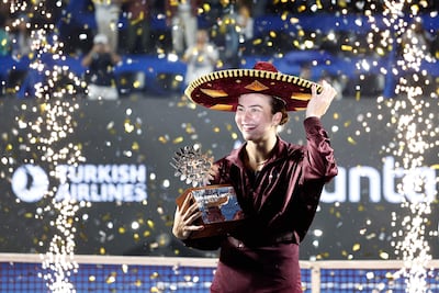 US Iva Jovic receives the trophy after winning the women's singles final match of the WTA Guadalajara Open tournament at the Panamerican Tennis Center in Zapopan, Mexico on September 19, 2026. (Photo by ULISES RUIZ / AFP)