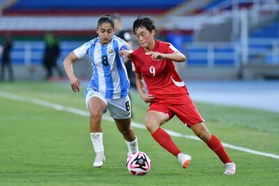 Argentina's midfielder Sofia Dominguez (L) and North Korea's midfielder Song Gyong Kim fight for the ball during the 2024 FIFA U-20 Women's World Cup match between North Korea and Argentina at the Pascual Guerrero stadium in Cali, Colombia, on September 2, 2024. (Photo by Nelson Rios / AFP)