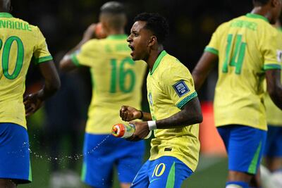 Brazil's forward Rodrygo celebrates after scoring during the 2026 FIFA World Cup South American qualifiers football match between Brazil and Ecuador, at the Major Antônio Couto Pereira stadium in Curitiba, Brazil, on September 6, 2024. (Photo by Mauro PIMENTEL / AFP)