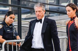 British actor Hugh Grant and Swedish producer Anna Elisabet Eberstein arrive at Madison Square Garden, the reported venue for the wedding celebrations of pop singer Taylor Swift and pro-athlete Travis Kelce, in New York City on July 3, 2026. Swift and Kelce's official wedding plans are tightly under wraps, but New York is bracing to host the celebrity marriage of the year this week at Madison Square Garden. The wedding will reportedly take place Friday with a star-studded guest list of around 1,000, including models Gigi Hadid and Cara Delevingne, singer Selena Gomez, and actress Zoe Kravitz -- all known to be close Swift pals -- and Kelce's Kansas City Chiefs teammates. (Photo by kena betancur / AFP)