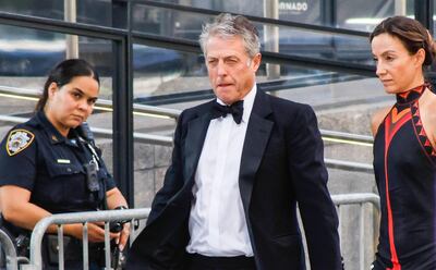 British actor Hugh Grant and Swedish producer Anna Elisabet Eberstein arrive at Madison Square Garden, the reported venue for the wedding celebrations of pop singer Taylor Swift and pro-athlete Travis Kelce, in New York City on July 3, 2026. Swift and Kelce's official wedding plans are tightly under wraps, but New York is bracing to host the celebrity marriage of the year this week at Madison Square Garden. The wedding will reportedly take place Friday with a star-studded guest list of around 1,000, including models Gigi Hadid and Cara Delevingne, singer Selena Gomez, and actress Zoe Kravitz -- all known to be close Swift pals -- and Kelce's Kansas City Chiefs teammates. (Photo by kena betancur / AFP)