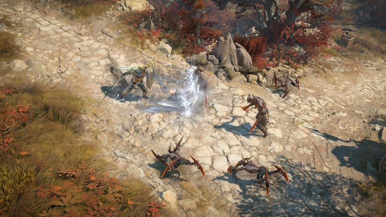 Persona en medio de la naturaleza, rodeada de rocas y agua, disfrutando de un videojuego de aventura.