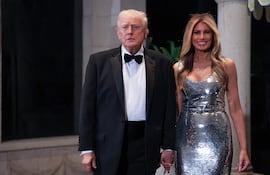 Donald Trump y Melania Trump llegando a su residencia de Mar-a-Lago el 31 de diciembre. (Joe Raedle/Getty Images/AFP)