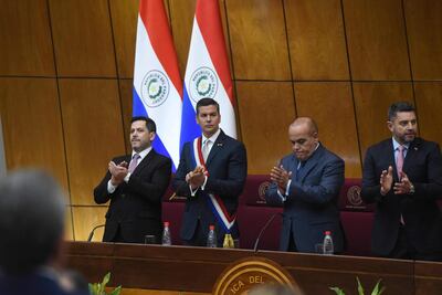 Paraguayan President Santiago Peña (2nd-L) applauds with President of Deputies Raul Latorre (L), President of Congress Basilio Nuñez (2nd-R), and Paraguayan Vice President Pedro Aliana before delivering his annual report to the National Congress in Asuncion on July 1, 2024. (Photo by DANIEL DUARTE / AFP)