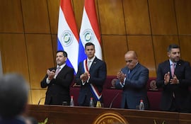 Paraguayan President Santiago Peña (2nd-L) applauds with President of Deputies Raul Latorre (L), President of Congress Basilio Nuñez (2nd-R), and Paraguayan Vice President Pedro Aliana before delivering his annual report to the National Congress in Asuncion on July 1, 2024. (Photo by DANIEL DUARTE / AFP)