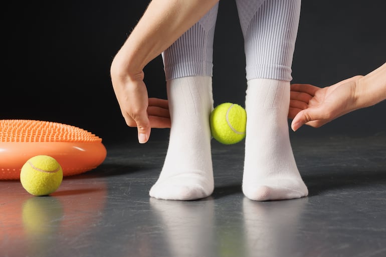 Automasaje con pelotas de tenis.