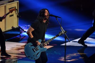 US musician Dave Grohl (C) performs with the Foo Fighters on stage during the 2021 MTV Video Music Awards at Barclays Center in Brooklyn, New York, September 12, 2021. (Photo by ANGELA WEISS / AFP)