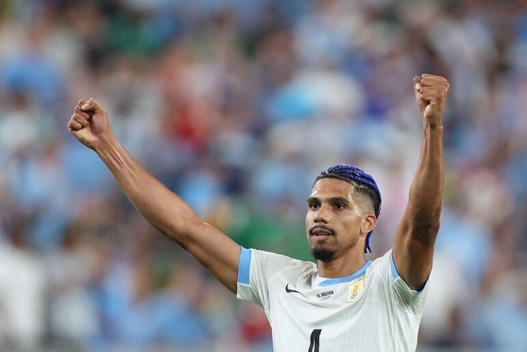 Uruguay's defender #04 Ronald Araujo celebrates after winning the Conmebol 2024 Copa America tournament group C football match between Uruguay and Bolivia at MetLife Stadium in East Rutherford, New Jersey, on June 27, 2024 (Photo by CHARLY TRIBALLEAU / AFP)