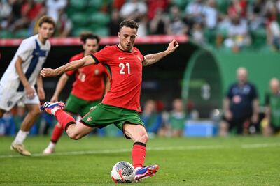 Portugal's forward #21 Diogo Jota makes a penalty kick and scores during the International friendly match between Portugal and Finland at Alvalade stadium in Lisbon on June 4, 2024, ahead of the UEFA Euro 2024 football tournament in Germany. (Photo by PATRICIA DE MELO MOREIRA / AFP)