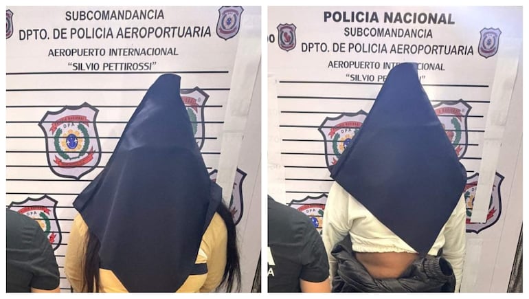 Dos mujeres cubiertas con mantas oscuras en un entorno policial, en el aeropuerto Silvio Pettirossi, mostrando partes de sus camisetas claras.