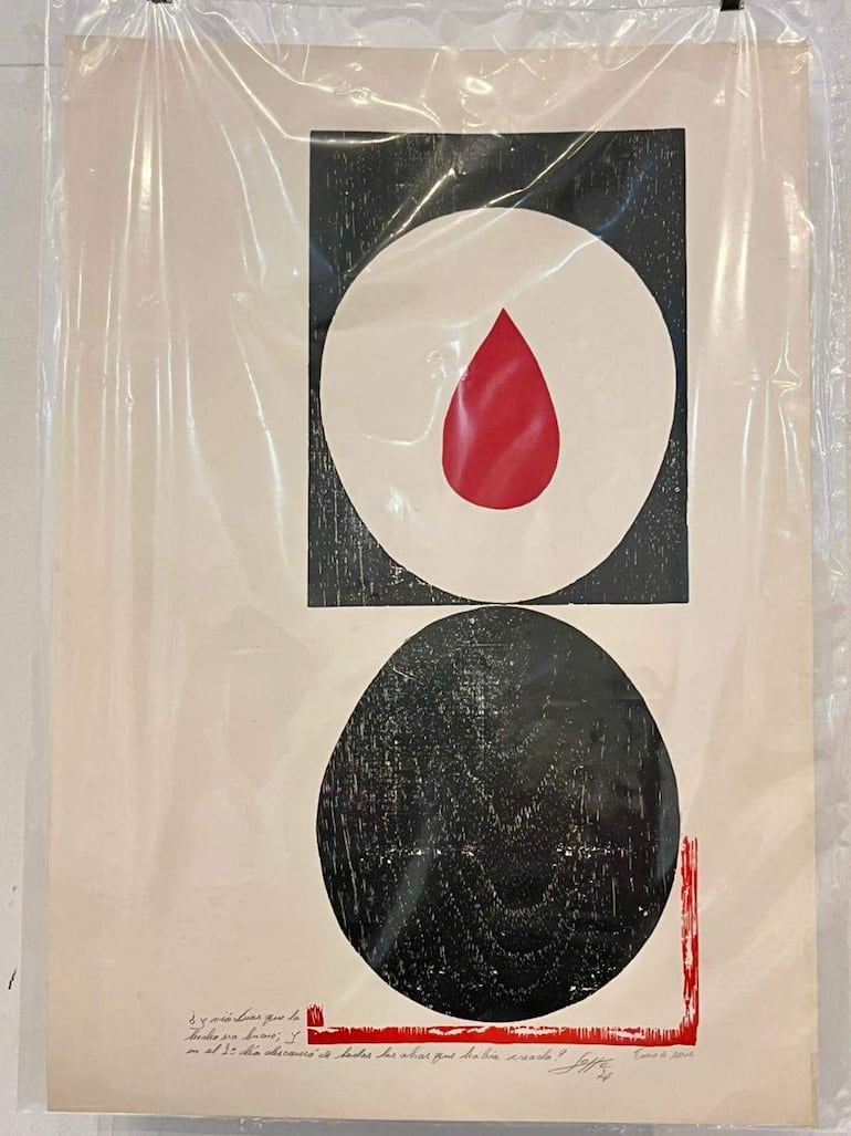 Obra abstracta de Lotte Schulz enmarcada y protegida, con formas geométricas y texto manuscrito en la parte inferior.