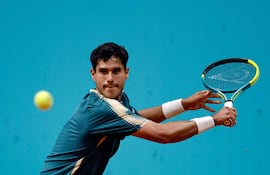 Paraguay's Adolfo Daniel Vallejo returns the ball to Italy's Flavio Cobolli during their 2026 ATP Tour Madrid Open tennis tournament third round singles match at the Caja Magica in Madrid, on April 27, 2026. (Photo by OSCAR DEL POZO / AFP)