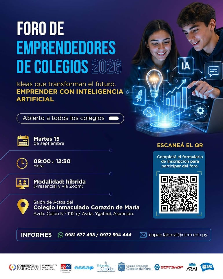 Dos jóvenes interactuando frente a computadora, discutiendo ideas sobre inteligencia artificial en un ambiente educativo formal.