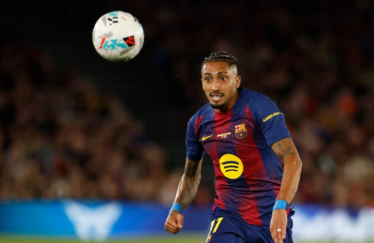 Barcelona's Brazilian forward #11 Raphinha goes for the ball during the Spanish league football match between FC Barcelona and Real Betis at the Camp Nou Stadium in Barcelona on May 17, 2026. (Photo by JAIME REINA / AFP)