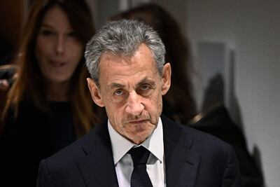 Nicolas Sarkozy en una foto de archivo. De fondo, su esposa, la cantante italiana Carla Bruni. 