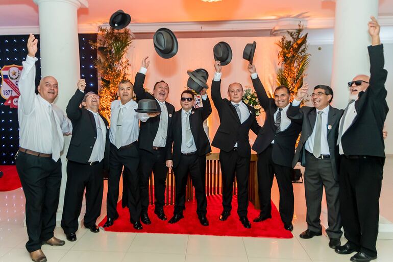 Representación Artística de la música Queen - We Will Rock You con la participación de los compañeros: Llano Rodríguez Martín Nelson,  Villalba Cabañas Pedro, Sánchez Cabañas Arsenio Dionisio, Deggeller Torres Alfredo Augusto, Vázquez Astorga Eugenio, Liuzzi Sandoval Arnaldo Leoncio, Alonso Montiel Walberto, Cantero Alarcon Juan Víctor, Quiñones Franco José Darío y Ruíz Díaz Oscar Vidal.