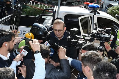 Former Senator Erico Galeano (C) is escorted in handcuffs into the Judicial Department in Asunción after receiving a 13 year prison sentence in Asunción on May 16, 2026. A sentencing court ordered on May 19 that a former senator convicted of ties to drug traffickingwho had been granted house arrest, meaning he was free to move aboutbe transferred to a prison in Asunción, judicial sources reported. (Photo by DANIEL DUARTE / AFP)