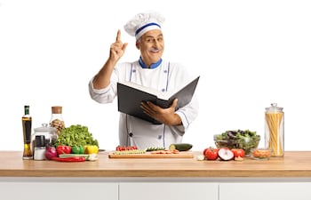 Cocinero con un libro de cocina.
