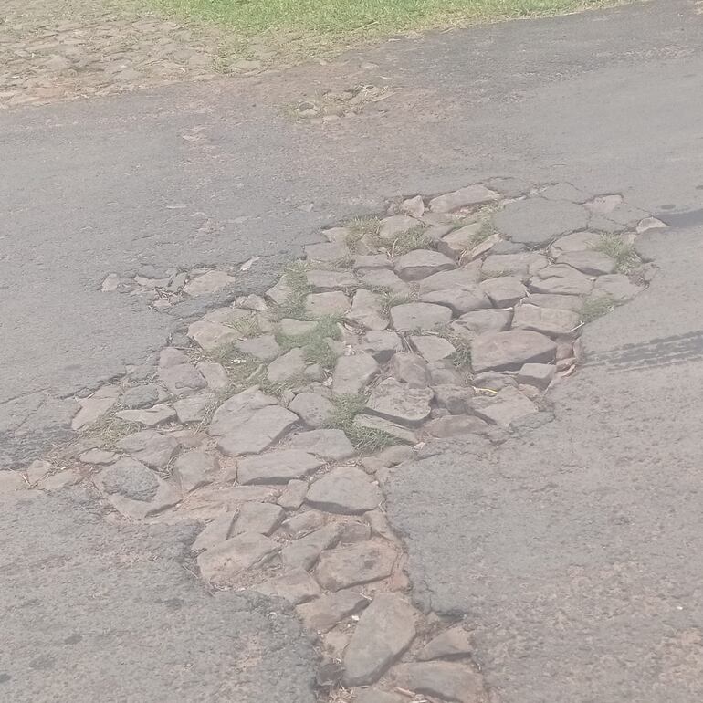 Calle lambareña en mal estado