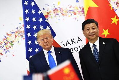 El presidente de China, Xi Jinping (d) y de Estados Unidos, Donald Trump.