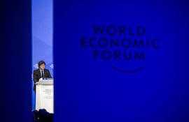 Argentinas President Javier Milei addresses the audience during the World Economic Forum (WEF) annual meeting in Davos on January 23, 2025. Milei said at a Bloomberg event on January 22, 2026 that "The world should celebrate the arrival of President Trump,"before Donald Trump will star on January 23, 2025 in an eagerly-anticipated online appearance at the World Economic Forum in Davos, addressing global elites whose annual gabfest has been consumed by the US president's days-old second term. (Photo by FABRICE COFFRINI / AFP)