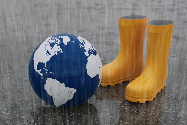 Botas de lluvia y un globo terráqueo.