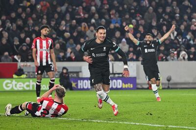 Liverpool's Uruguayan striker #09 Darwin Nunez celebrates after scoring his team first goal during the English Premier League football match between Brentford and Liverpool at the Gtech Community Stadium in London on January 18, 2025. (Photo by JUSTIN TALLIS / AFP) / RESTRICTED TO EDITORIAL USE. No use with unauthorized audio, video, data, fixture lists, club/league logos or 'live' services. Online in-match use limited to 120 images. An additional 40 images may be used in extra time. No video emulation. Social media in-match use limited to 120 images. An additional 40 images may be used in extra time. No use in betting publications, games or single club/league/player publications. / 