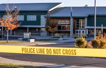 Police tape blocks access to Silver Rail Elementary School a day after a shooting at the school in Bend, Oregon, on October 16, 2026. Three children and one teacher were shot dead at an elementary school on October 15 in the northwestern US state of Oregon, police said, adding that the assailant was a 16-year-old who was killed by an armed bystander. (Photo by Payton Bruni / AFP)