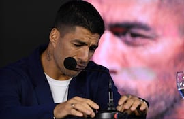 Uruguay's forward Luis Suarez gets emotional during a press conference at the Centenario Stadium in Montevideo on September 2, 2024. Luis Suarez, Uruguay's all-time leading scorer, announced that he will play his last game for La Celeste this Friday against Paraguay in Montevideo, on the seventh round of the South American qualifiers for the World Cup North America-2026. (Photo by Eitan ABRAMOVICH / AFP)