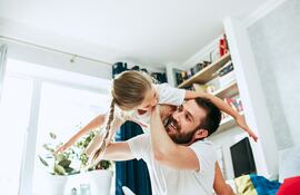 Father and his six years kid girl at home